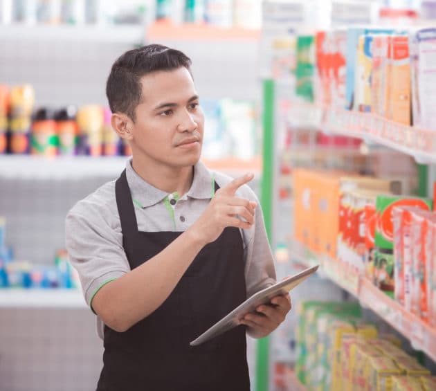 male shopkeeper working in a grocery store